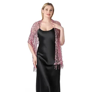 Elegant pink sequined embroidered lace shawl wrap shown on a black evening gown