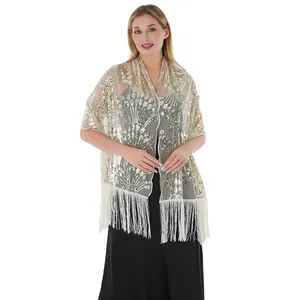 Front view of golden sequin shawl worn by a model against a clean white background