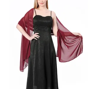 Detail view of a wine red chiffon shawl draped over a black evening dress on a model.