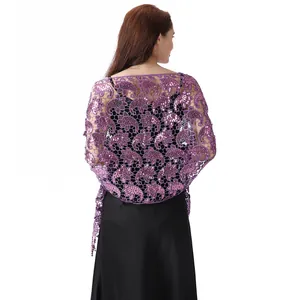 Detail view of elegant purple sequined paisley lace shawl over a black evening dress back