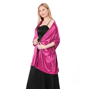 Detail view of elegant fuchsia satin shawl wrap tailored for evening wedding dresses