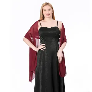 Elegant burgundy chiffon shawl styled with a black formal gown on a model detail