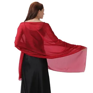 Detail view of a shimmering red evening shawl wrap for wedding party dresses