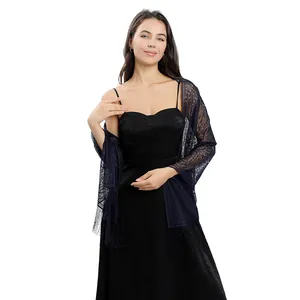 Detailed view of navy blue floral lace shawl with delicate fringe on evening dress