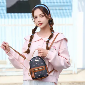 Fashionable printed mini backpack for women, versatile crossbody phone bag with bow pattern