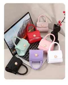 Collection of colorful mini jelly handbags with pearl closure and crocodile texture.