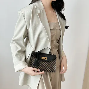 Elegant women's crossbody chain bag with geometric monogram print and gold lock.