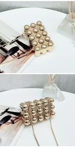 Detail showing the gold bubble design and chain strap of this cute mini acrylic bag