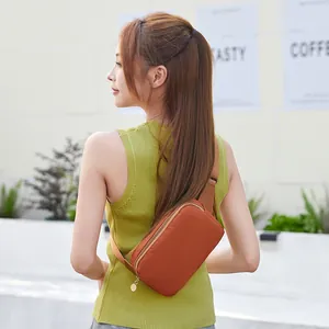 Minimalist burnt orange solid color women's crossbody chest bag with durable zipper closure