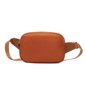 Minimalist solid orange chest bag for women with adjustable strap and zipper closure
