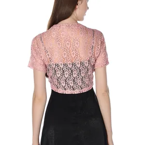 Detailed rear view of a plus size pink floral lace bolero shrug over a black dress