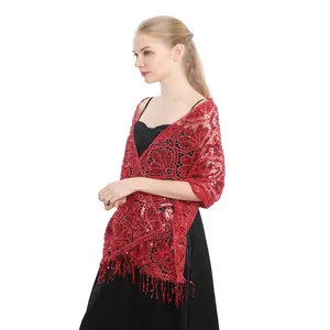 Red sequined evening shawl wrap with elegant fringe tassels worn over black dress