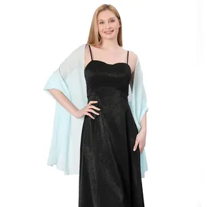 Elegant light blue chiffon shawl worn over a black formal evening dress