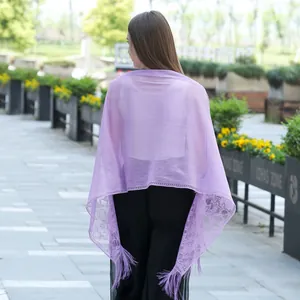 Detailed back view of a light purple lace shawl scarf with elegant fringe tassels