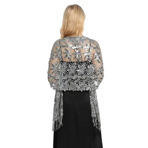 Detailed back view of a silver sequined shawl with fringe for elegant evening party wear
