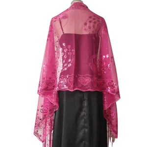 Back view of a fuchsia sequin shawl with peacock embroidery and tassels for party dresses.