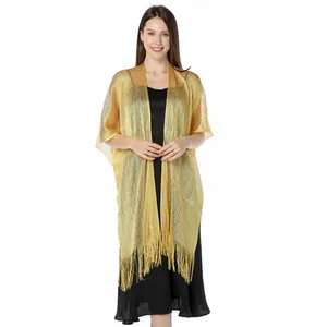 Detailed view of the gold metallic glitter shawl with elegant fringe tassels