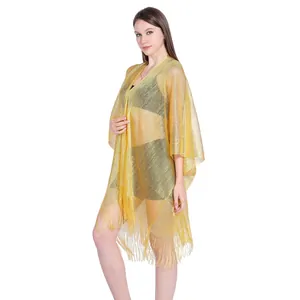 Sheer gold metallic bikini cover-up with fringe details for beach holiday wear