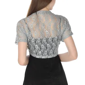 Detailed back view of a grey floral lace shrug bolero paired with an evening dress
