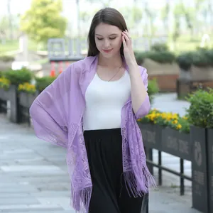Elegant light purple lace shawl scarf with long fringe tassels detail worn by model