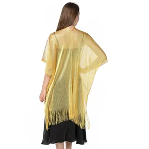 Back view detail of a gold metallic shimmer shawl with fringe for evening wear
