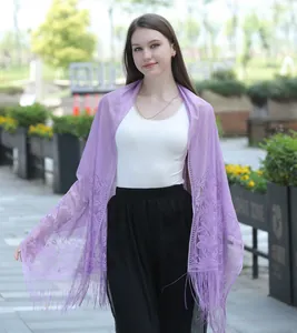 Elegant light purple lace shawl scarf featuring intricate floral patterns and fringe