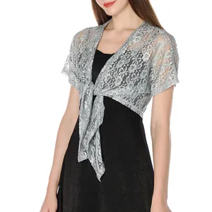 Close-up detail of grey floral lace shrug with front tie design for evening gowns.