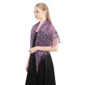 Detailed side view of a purple lace shawl with sequins and long fringes on a model