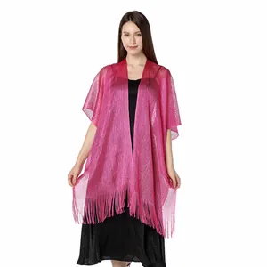 Detailed view of fuchsia metallic shawl showing shimmering texture and long fringes