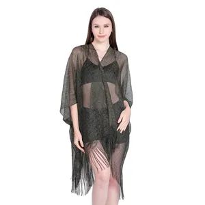 Shimmering metallic thread bikini cover-up shawl with elegant fringe detail for beach.