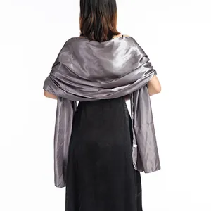 Elegant silver satin shawl for evening dresses shown from the back on a model