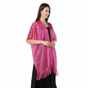 Detailed side view of a shimmering pink metallic lurex shawl with elegant long fringe detail.