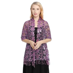 Detailed view of purple water-soluble lace shawl with sparkling sequins and tassels