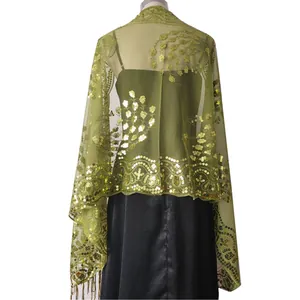 Back view of green sheer evening shawl with sequined peacock embroidery and tassels
