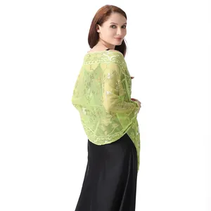 Elegant light green sheer shawl with gold sequins shown on model over evening dress