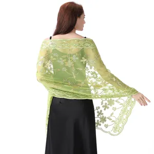 Detailed back view of a light green sequined lace shawl for evening wedding dresses