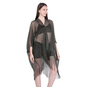 Detailed view of semi-transparent metallic fringe shawl bikini cover-up with slit sleeves