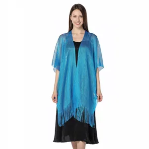 Elegant blue metallic sparkling shawl with fringe detail shown on a model for formal wear