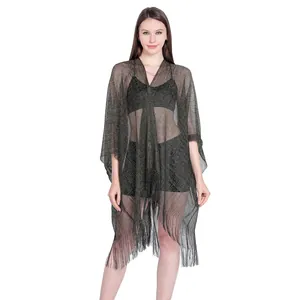 Detailed view of sheer metallic thread bikini cover-up with elegant fringe hem design