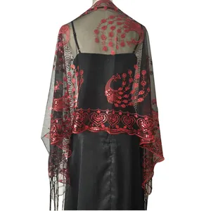 Back view of black mesh wrap with red sequined peacock embroidery and fringe tassels