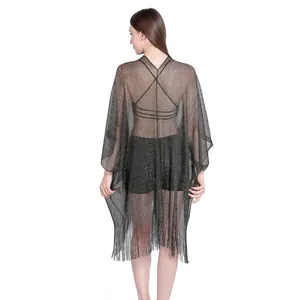 Back view of shimmering black gold wire shawl cover-up with elegant fringe detail