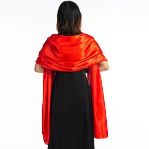 Back view of a vibrant red satin shawl draped over a black formal evening dress