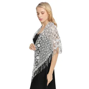 Elegant white lace sequined evening wedding shawl with fringe tassels on a model