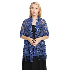 Detailed macro view of elegant blue floral lace shawl with sequins and fringe