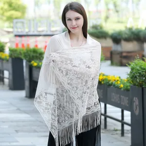 Elegant white floral lace shawl with long tassels for evening dresses or wedding gowns.