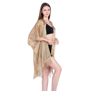 Full side view highlighting the gold metallic texture and fringe of the beach kimono