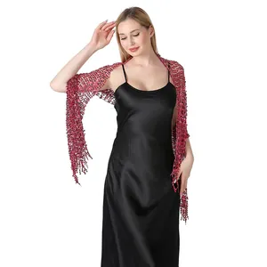 Detailed view of sparkling burgundy sequins on an elegant evening mesh shawl wrap