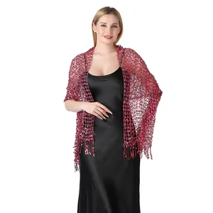 Close-up detail of a rose pink sequin embroidered shawl with elegant fringe for parties