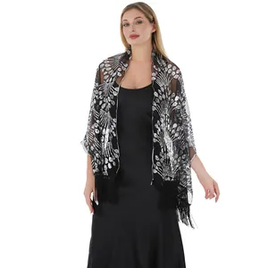Detail view of elegant black sequin tassel shawl with peacock tail embroidery pattern