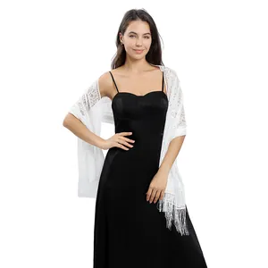 Elegant white floral lace evening shawl with fringe worn over black dress